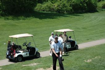 Golfers and golf cart.