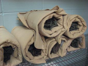Rolled jail bed sheets.