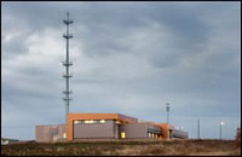 SECC building with overcast clouds.