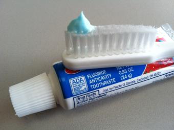 Toothbrush with fluoride toothpaste