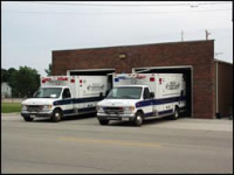 Two ambulances in their garage bays.