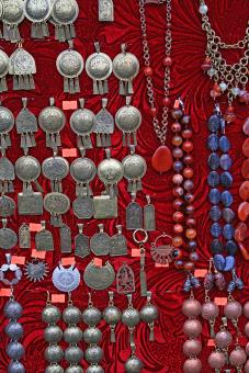 homemade jewelry with red background