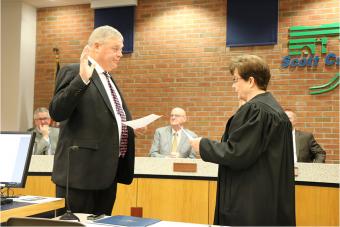 Swearing in Supervisor John D. Maxwell.