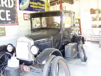 An antique automobile in the repair garage.