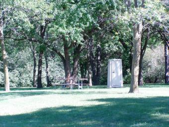 Picnic table under the trees.