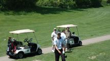 Golfers and golf cart.